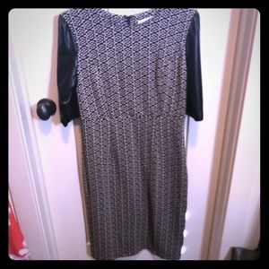 Black and cream form fitting dress